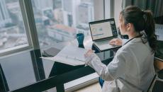 Healthcare worker using laptop