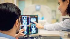 Doctors looking at X-ray on a screen