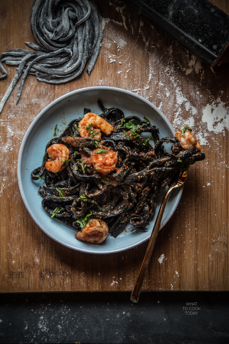 Homemade squid ink pasta with shrimp and garlicky tomato sauce
