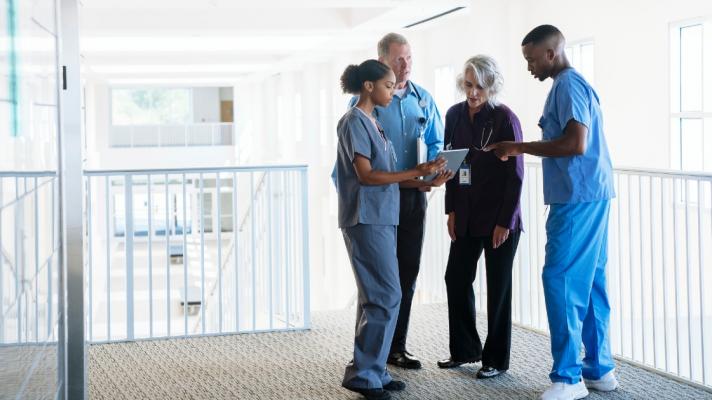 Nurse huddle with tablet