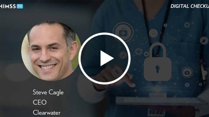 Steve Cagle at Clearwater_Doctor using tablet with holograms photo by PeopleImages/iStock/Getty Images Plus