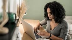 Person at desk on laptop